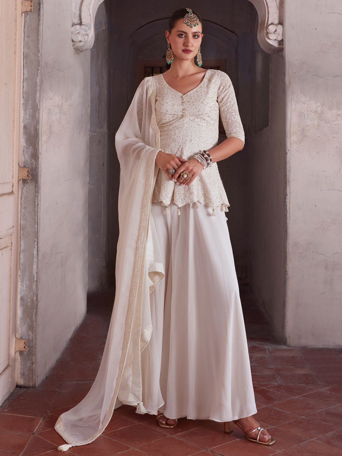 Off White Georgette Peplum Style Sharara Suit Inddus