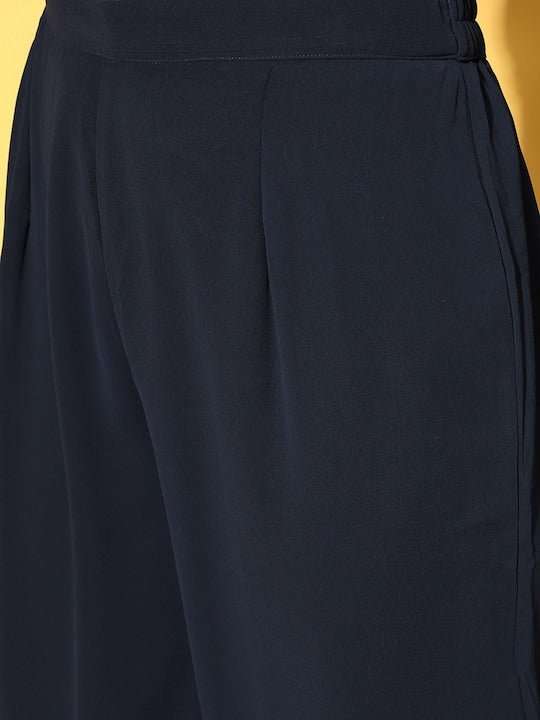 Women Ethnic Motifs Poly Georgette Plisse Kurta Set - Inddus.com